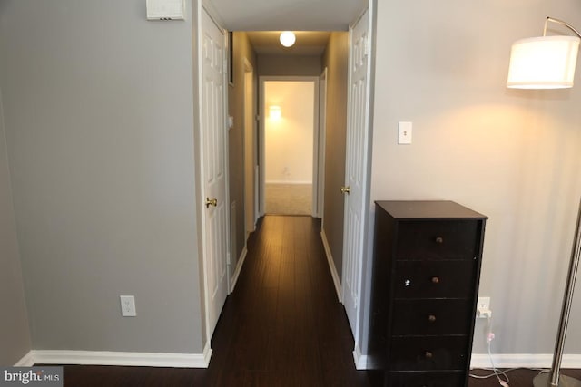 hall with dark hardwood / wood-style floors