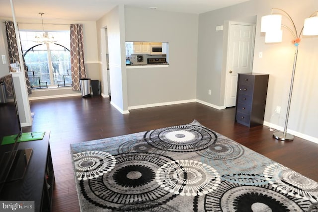 interior space with dark hardwood / wood-style flooring and a chandelier