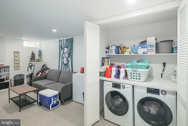 laundry area featuring washing machine and clothes dryer