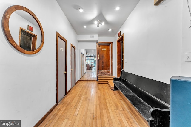 hall with light wood-type flooring