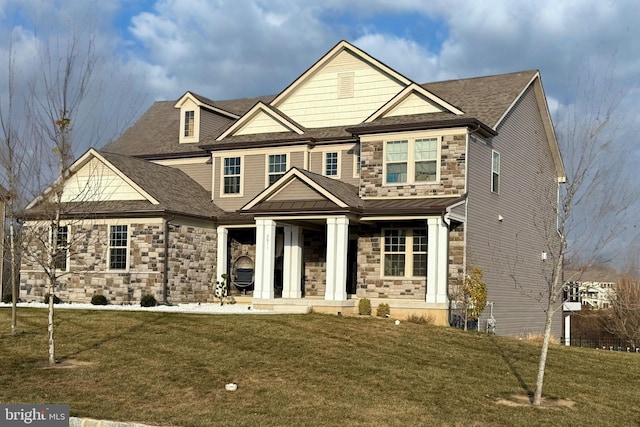 craftsman-style house featuring a front yard