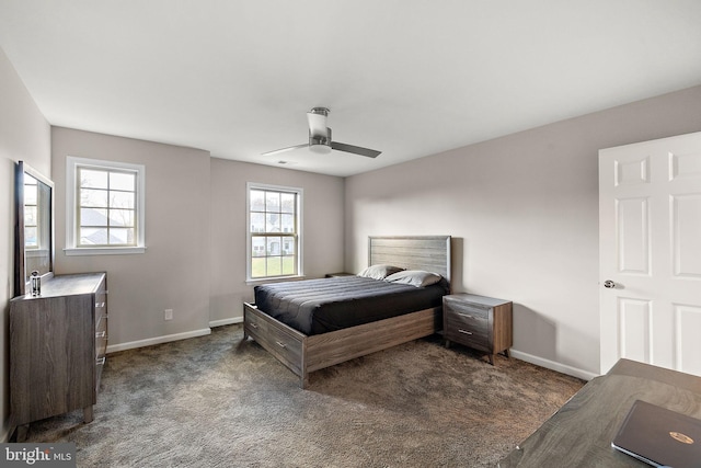 carpeted bedroom featuring multiple windows and ceiling fan