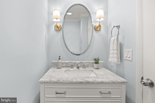 bathroom featuring vanity and ornamental molding