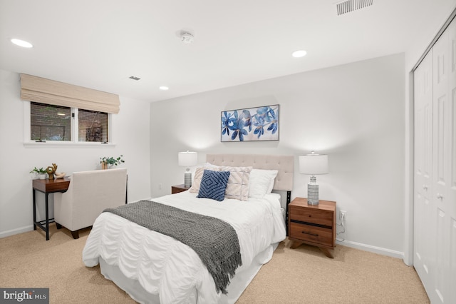 carpeted bedroom with a closet