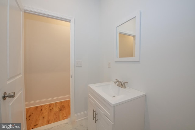 bathroom featuring hardwood / wood-style floors and vanity