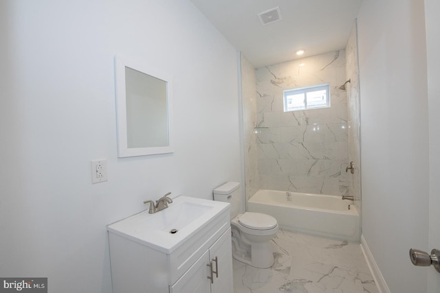 full bathroom featuring toilet, vanity, and tiled shower / bath