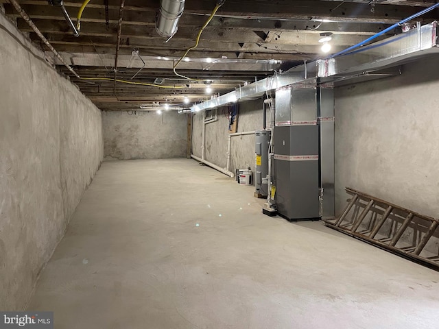 basement with heating unit and water heater