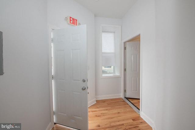 corridor featuring light hardwood / wood-style floors