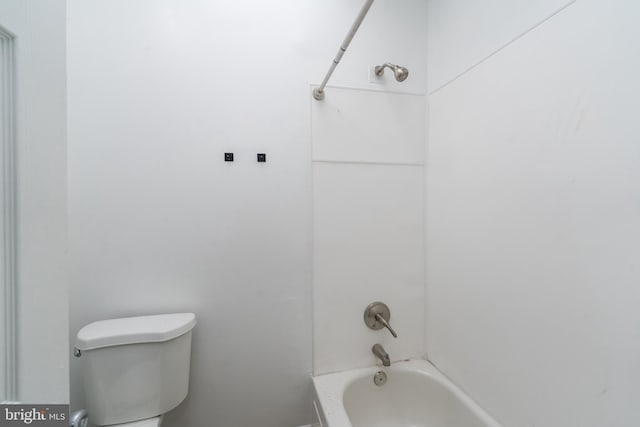 bathroom with shower / bath combination and toilet