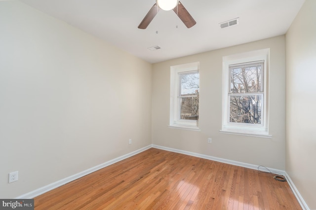 unfurnished room featuring ceiling fan and light hardwood / wood-style flooring