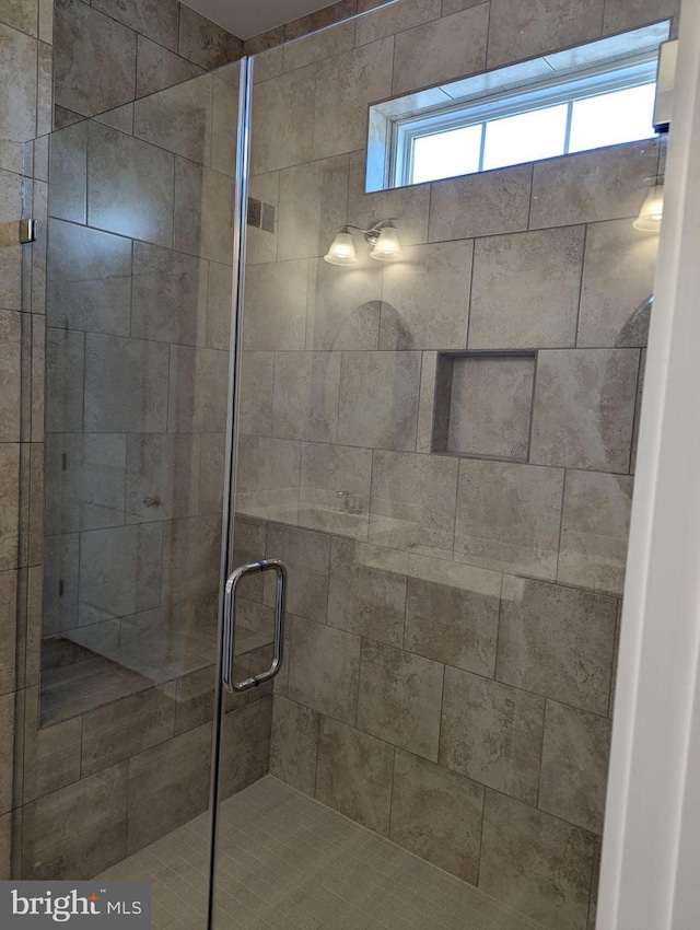 bathroom featuring a stall shower