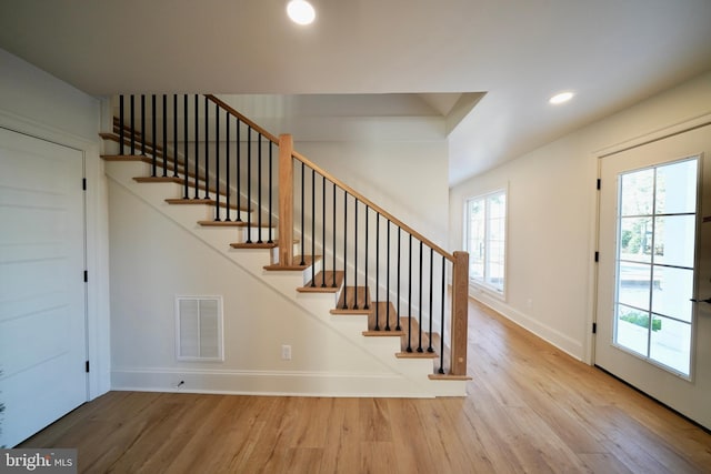 staircase featuring hardwood / wood-style floors