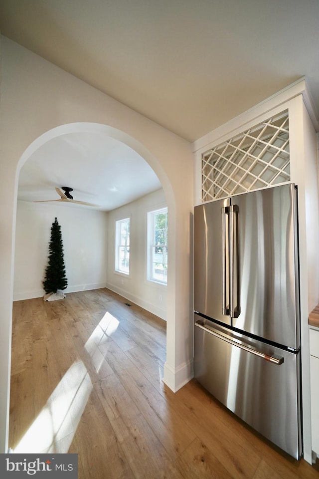 kitchen with ceiling fan, light hardwood / wood-style flooring, and high end refrigerator