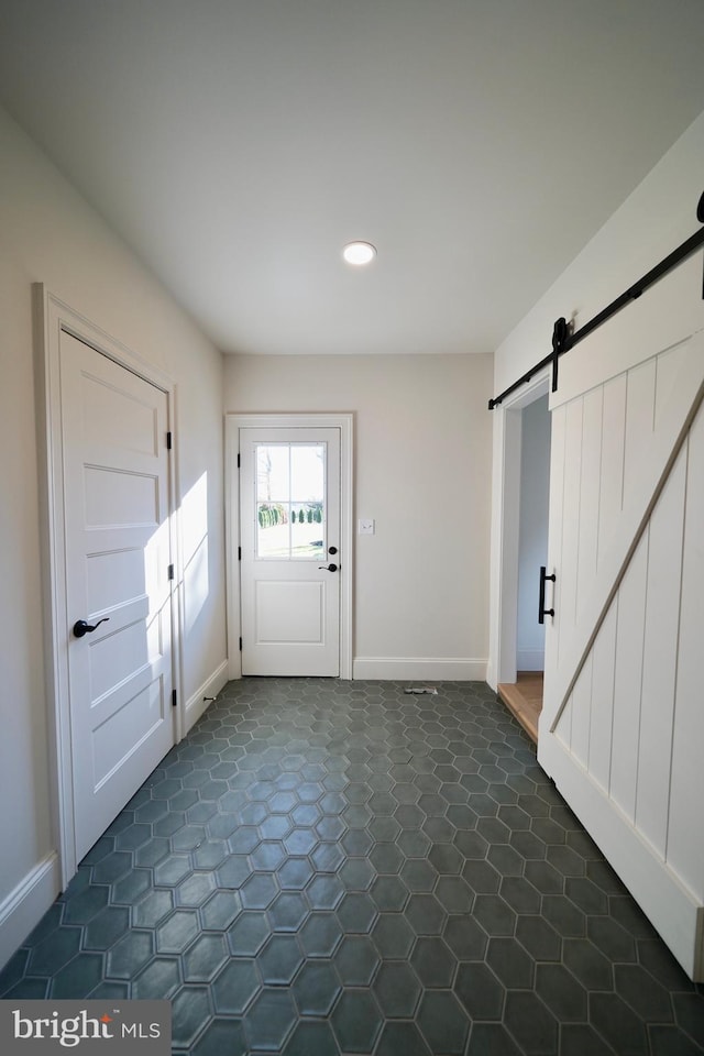 doorway to outside featuring a barn door