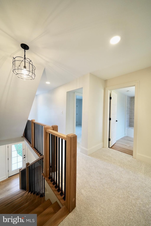 interior space with wood-type flooring and a notable chandelier