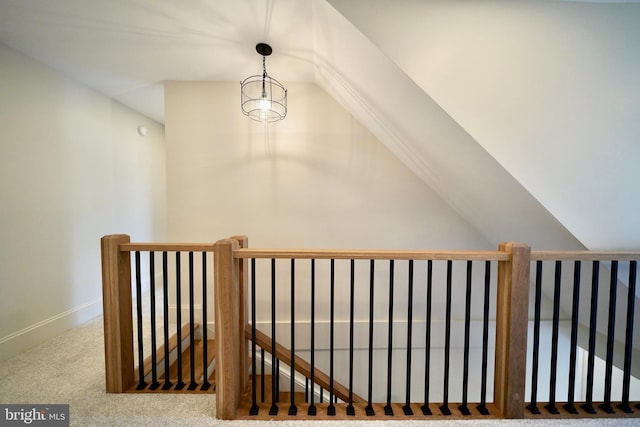 stairs with carpet and vaulted ceiling