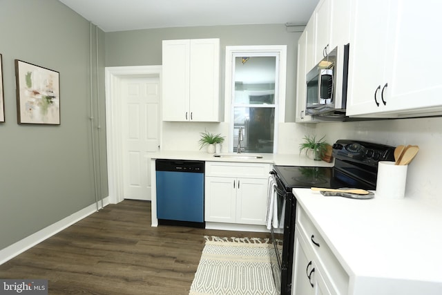 kitchen featuring dark hardwood / wood-style floors, white cabinetry, sink, and appliances with stainless steel finishes