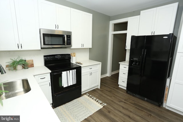 kitchen featuring black appliances, dark hardwood / wood-style flooring, white cabinets, and sink