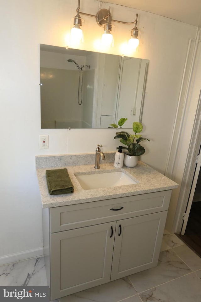 bathroom featuring vanity and a shower