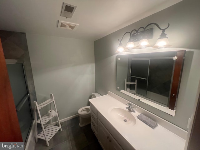 bathroom with tile patterned floors, vanity, and toilet