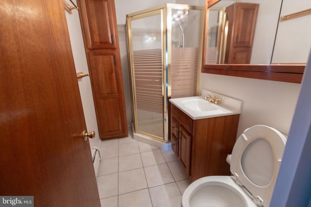 bathroom with tile patterned floors, a shower with door, vanity, and a baseboard radiator