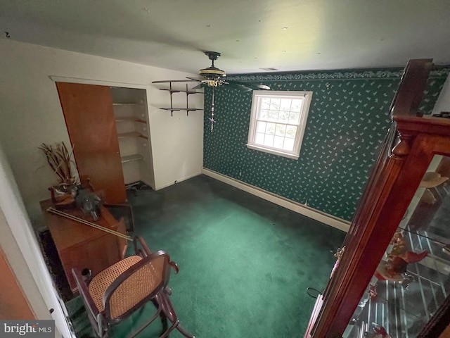 interior space featuring carpet and ceiling fan