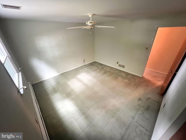 unfurnished room with ceiling fan