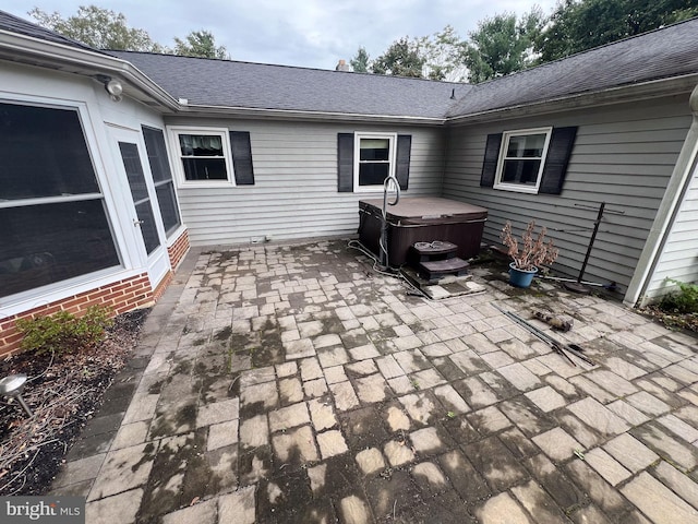 view of patio / terrace featuring a hot tub