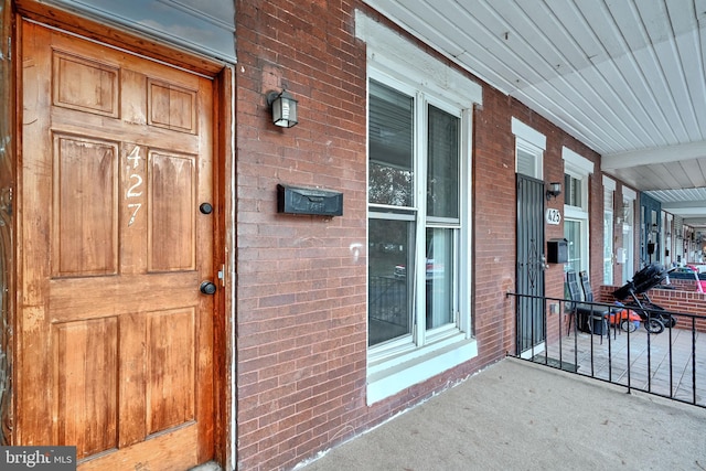 property entrance with covered porch