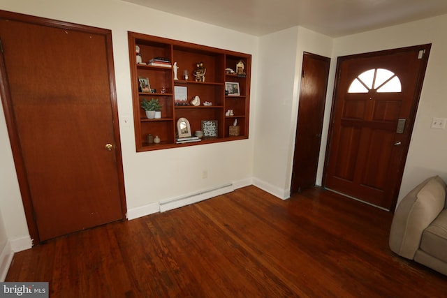 foyer entrance featuring dark wood-type flooring and a baseboard radiator