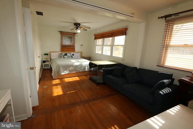 bedroom featuring hardwood / wood-style floors and ceiling fan