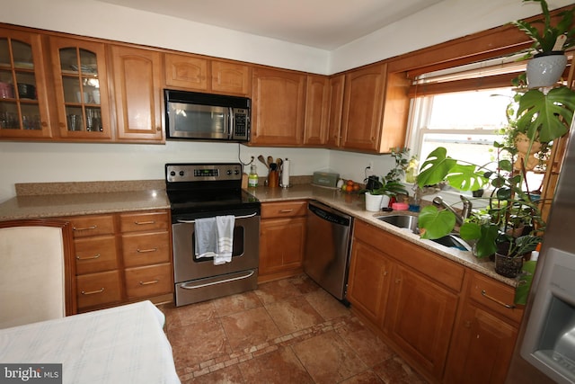 kitchen with sink and appliances with stainless steel finishes