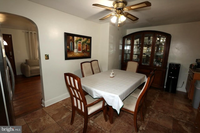 dining area featuring dark hardwood / wood-style floors and ceiling fan