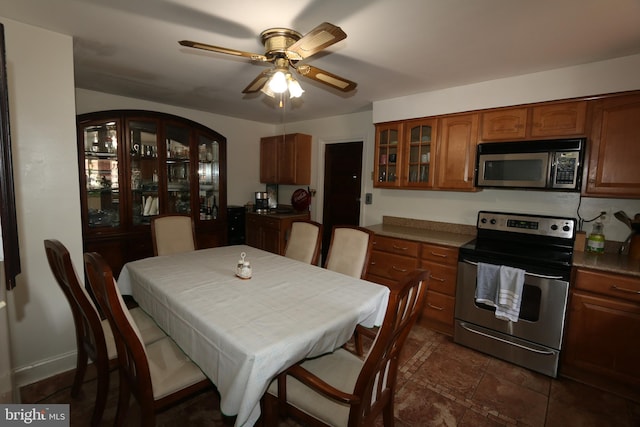 dining space featuring ceiling fan