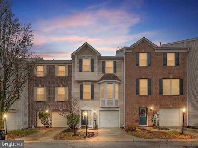 multi unit property featuring a garage