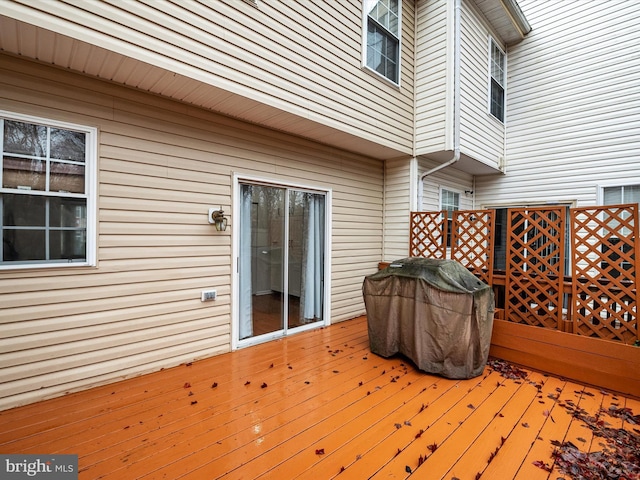 deck featuring a grill