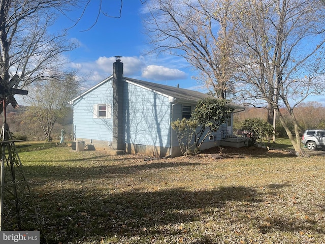 view of home's exterior with a lawn