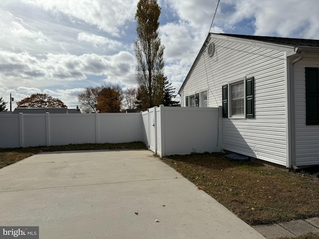 view of side of property with a patio area