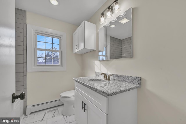 bathroom with baseboard heating, vanity, and toilet