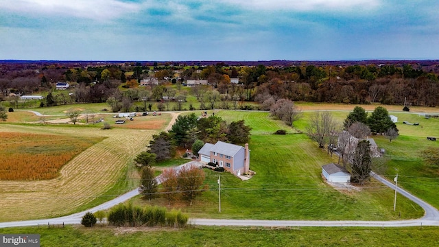 birds eye view of property featuring a rural view