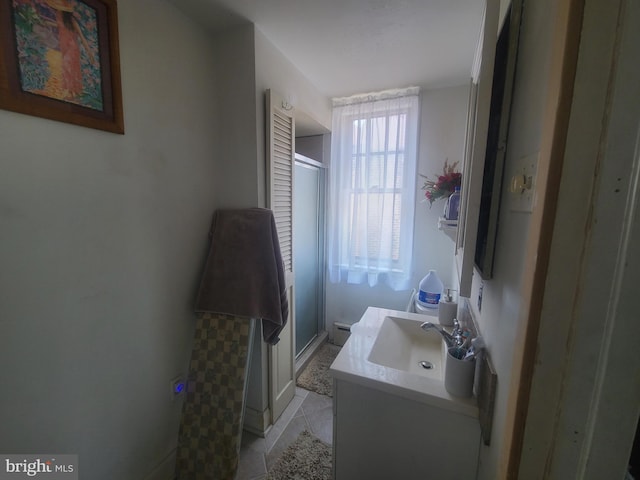 4938 State Rd, Drexel Hill, PA 19026 - bathroom featuring vanity, a stall shower, a baseboard heating unit, and tile patterned floors