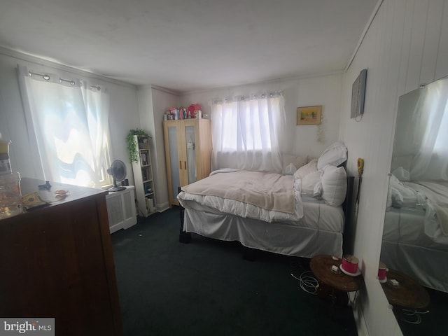 carpeted bedroom featuring ornamental molding