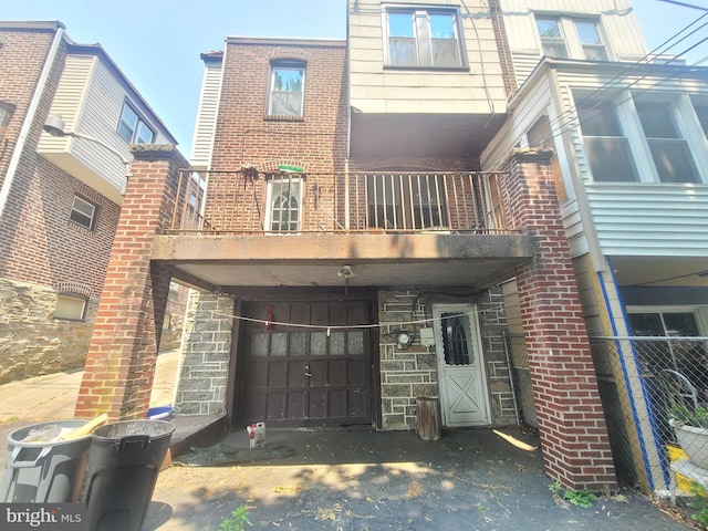 back of property with a balcony