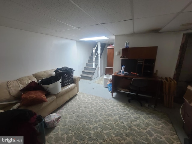 living room with a paneled ceiling