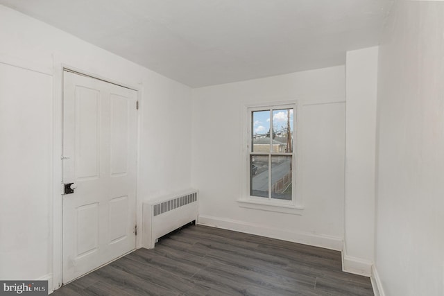 interior space featuring radiator and dark wood-type flooring