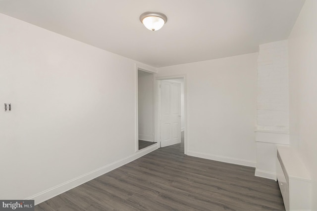 unfurnished room featuring dark hardwood / wood-style floors