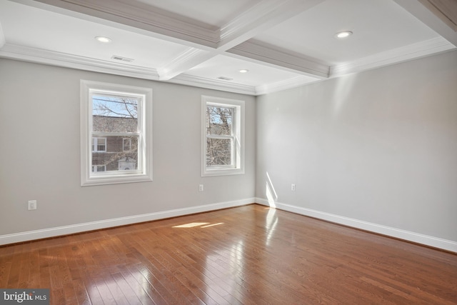 unfurnished room with beam ceiling, hardwood / wood-style floors, coffered ceiling, and ornamental molding