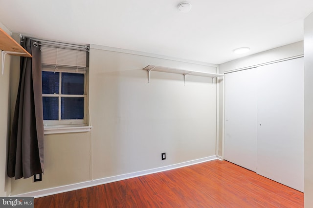 walk in closet with wood-type flooring