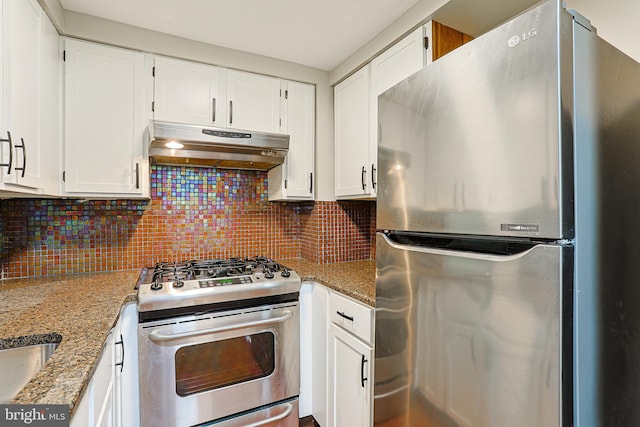 kitchen featuring light stone countertops, white cabinets, and stainless steel appliances