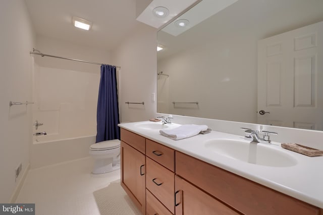 full bathroom featuring vanity, shower / tub combo, and toilet